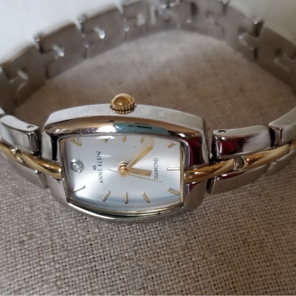 ANNE KLEIN SILVER N GOLD WATCH WITH SMALL DIAMOND.